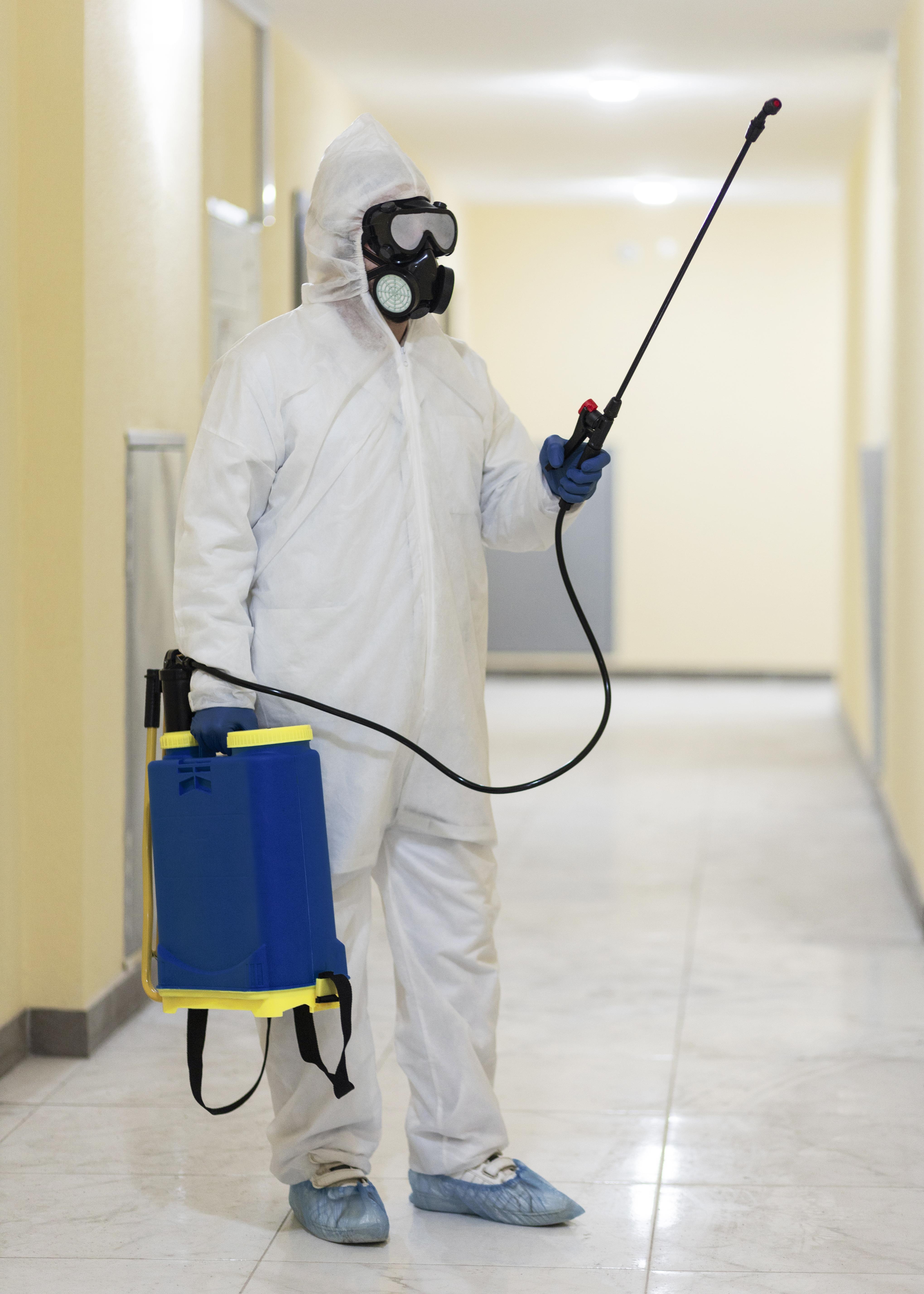 Person fixing an air conditioning unit indoors